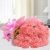 Blushing pink carnations arranged in a charming floral bunch.