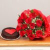 Elegant chocolate cake decorated with intricate edible flowers and floral accents.
