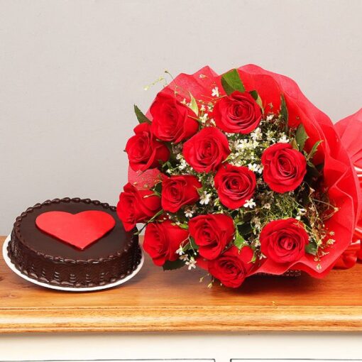 Elegant chocolate cake decorated with intricate edible flowers and floral accents.