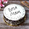 Delicate Mom’s Love Tribute cake with floral decorations and gift bundle.