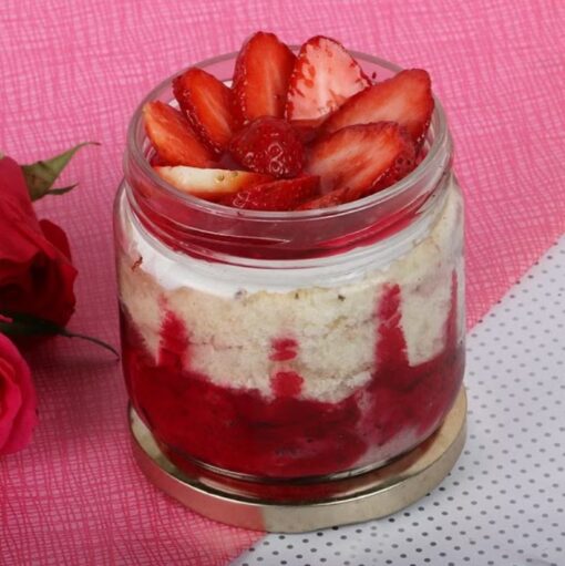 Berry Bliss Jar Treat showcasing a jar dessert layered with fresh mixed berries, cream, and cake, ideal for a sweet and convenient treat.