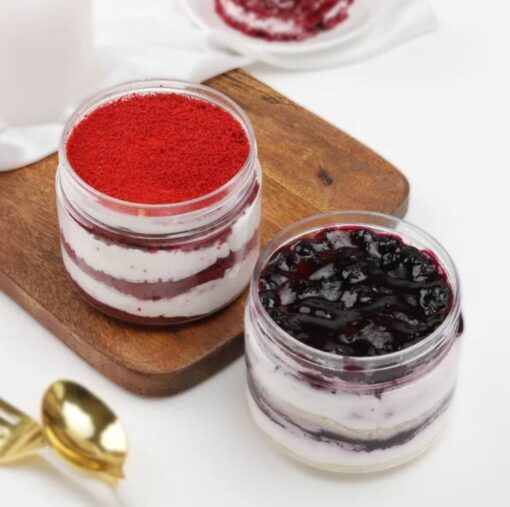 Berry Red Velvet Duo showcasing two jars filled with layered red velvet cake and fresh berry cream, ideal for special occasions and gifting.