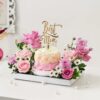 Brilliant Mother's Day Blooms bouquet featuring radiant pink and red roses with lush greenery, beautifully arranged as a heartfelt gift for mom
