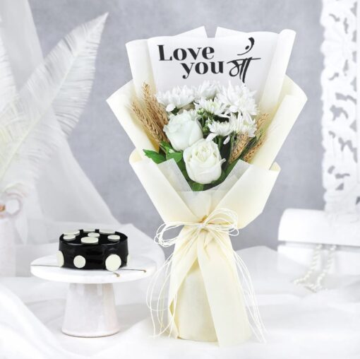 Mom Blooms Bouquet featuring pink roses, white lilies, yellow tulips, and purple orchids arranged in a vibrant floral display