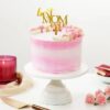 Floral-themed Blooming Affection Cake with pink and white cream swirls, made for Mother's Day celebration.