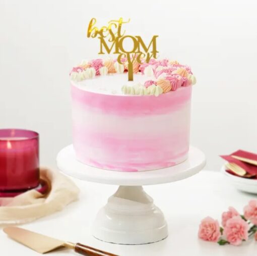 Floral-themed Blooming Affection Cake with pink and white cream swirls, made for Mother's Day celebration.