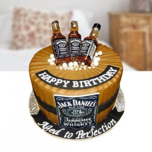 Elegant whiskey-infused cake decorated for celebration.