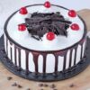 Black Forest Cherry Delight cake with chocolate layers, whipped cream, cherry filling, and chocolate shavings.