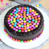 Chocolate Gemstone Bliss—chocolate cake decorated with colorful candy gems.