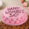 Feminine Chocolate Celebration Cake with chocolate layers and pink rose floral decorations.