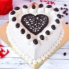 Heart-shaped Coffee Kiss Cake with coffee-flavored creamy frosting and delicate decoration.