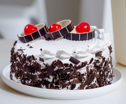 Decadent chocolate cake with whipped cream, cherries, and chocolate shavings—Choco Forest Delight.