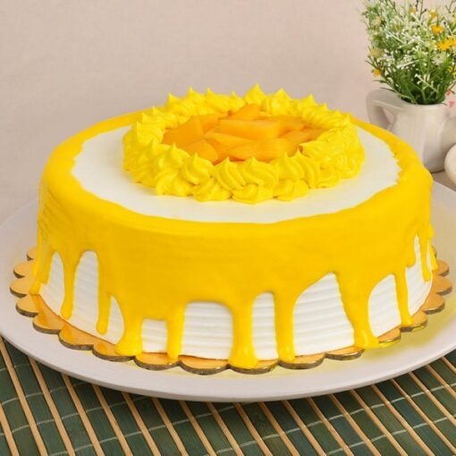 Mango Passion Layered Cake with moist vanilla sponge, fresh mango cubes, passion fruit jam, and creamy frosting.