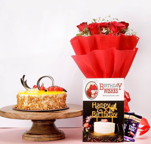 Sweet Floral Love Combo – a gift set with butterscotch cake, pink flowers, and chocolates arranged beautifully for birthdays, anniversaries, or romantic surprises.