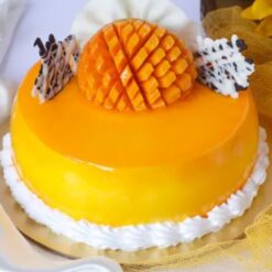 Mango Velvet Cake – layered cake with fresh mango puree and creamy frosting.
