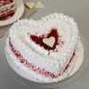 Velvety Heart Delight – creamy heart-shaped cake with elegant floral decoration.