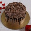 Rose-Adorned Chocolate Delight cake decorated with rich chocolate layers and delicate buttercream rose designs.