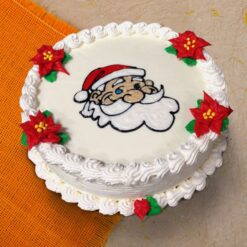 Jolly Santa Fondant Cake with detailed Santa Claus figurine and festive decorations.