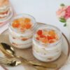 Quad Fruit Fusion Jars showcasing four glass jars filled with layered mixed fruit cakes and fresh fruit toppings, ideal for celebrations and gift sets.