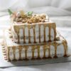 Elegant golden treasure chest-style box filled with assorted chocolates