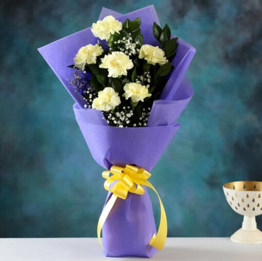 Golden Carnation Radiance Bouquet with vibrant golden carnations, sunflowers, and golden roses arranged elegantly