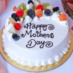 Natural Fruit Cake with dried fruits, nuts, and spices, decorated with cream cheese frosting
