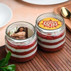 Heroic Red Velvet Jar featuring layers of moist red velvet cake and creamy frosting in a decorative jar, ideal for personalized gifting.