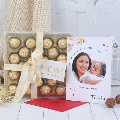 Mom's Exclusive Delight gift box with assorted gourmet chocolates, flowers, and elegant packaging