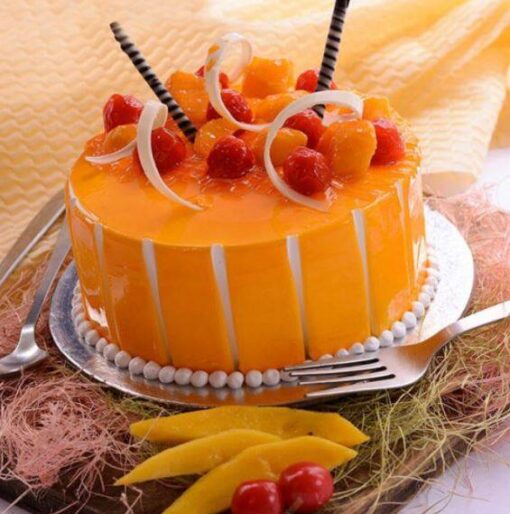 Mango Passion Cake with layered sponge, mango passion fruit jam filling, and cream cheese frosting topped with fresh mango slices