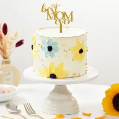 Elegant Mom’s Floral Delight Cake adorned with colorful edible flowers and delicate icing details