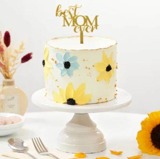 Elegant Mom’s Floral Delight Cake adorned with colorful edible flowers and delicate icing details