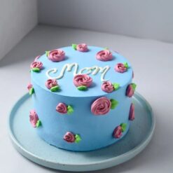 Mom’s Sapphire Bloom Cake – elegant blue floral cake decorated with buttercream flowers and delicate accents.