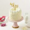 Elegant Mom Celebration Cake with cream frosting and floral decorations