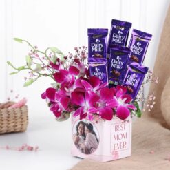 Orchid Bliss for Mom bouquet featuring vibrant purple and white orchids arranged elegantly in a decorative vase
