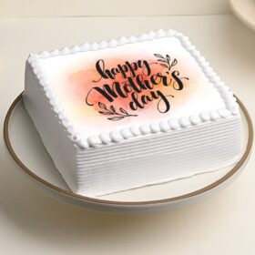 Mom’s Square Celebration Cake – elegant square-shaped cake with delicate decorations and smooth frosting.
