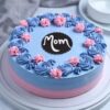 Strawberry Velvet Mom Cake – moist pink velvet cake layered with strawberry cream cheese frosting and fresh strawberry garnish.