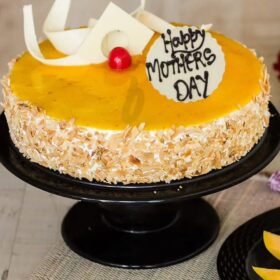 Luscious Mango Treat Cake – layered cake with fresh mango slices and creamy frosting