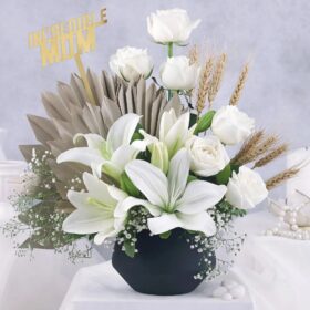Opulent White Lily Roses bouquet featuring white lilies and elegant white roses arranged beautifully