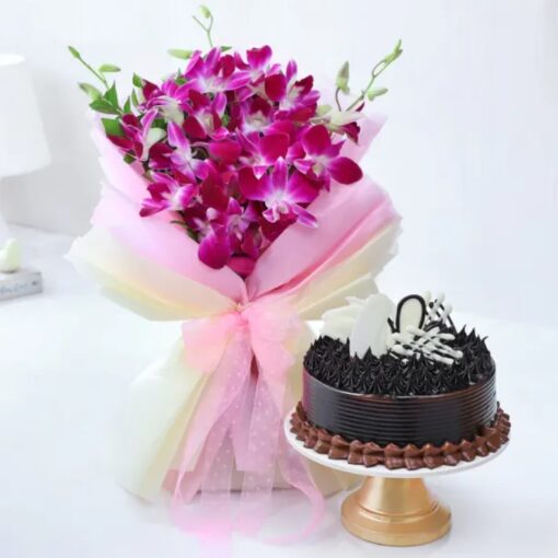 Orchid and Cake Delight featuring a vibrant orchid bouquet alongside a rich chocolate cake