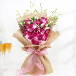 Symphony of Orchids Bouquet with pink Dendrobium orchids and white roses arranged elegantly