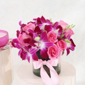 Orchid Rose Harmony Vase featuring vibrant orchids and soft pink roses arranged beautifully in a circular glass vase