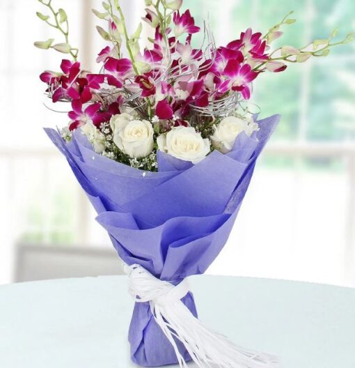 Elegant bouquet of premium roses and exotic orchids—Regal Rose & Orchid Bundle.