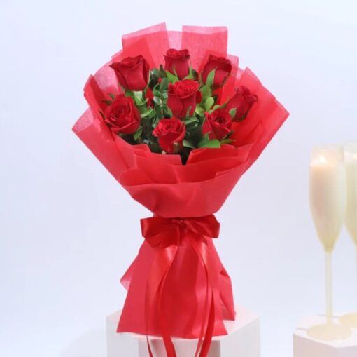 Embrace of Passion Blooms bouquet featuring vivid red and pink flowers arranged elegantly for romantic gifting