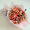 Blushing Pink Daisy Bouquet – soft pink daisies arranged in an elegant bouquet