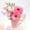 Delicate Pink Petal Tribute bouquet with soft pink flowers arranged elegantly
