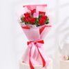Playful Love Flower Bunch with light pink roses, lavender daisies, purple carnations, and white waxflower in a lavender vase