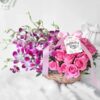 Mom’s Orchid Rose Basket with vibrant purple orchids and delicate pink roses arranged in a woven basket