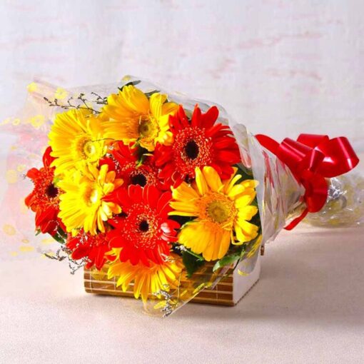 Vibrant red and yellow gerbera flowers arranged in a colorful bouquet.