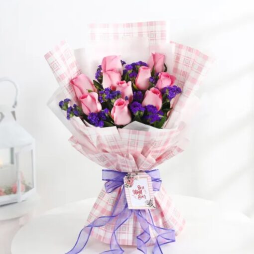 Regal Rose Mother's Tribute bouquet featuring premium red roses and lush greenery arranged elegantly