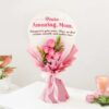 Mother’s Embrace Rose Bouquet featuring lush pink and red roses arranged in a cozy, inviting setting, symbolizing comfort and motherly love.